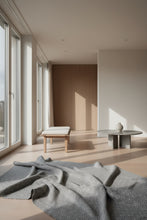 Load image into Gallery viewer, Patterned fabric with a diamond grid design in gray and white.