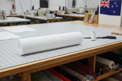 sew foam roll white on workshop cutting table and small nz flag top right corner